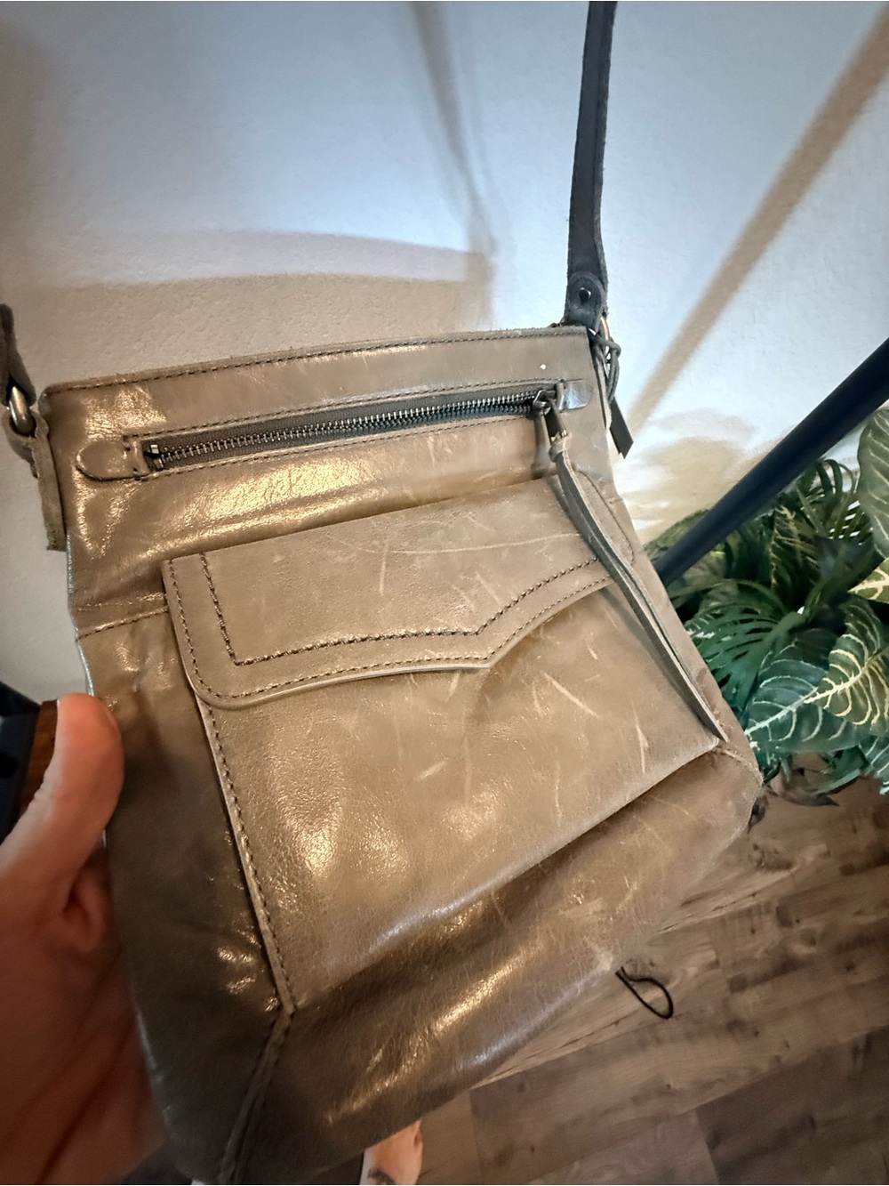 The Sak Ventura Flap Organizer Crossbody bag in a weathered gray leather